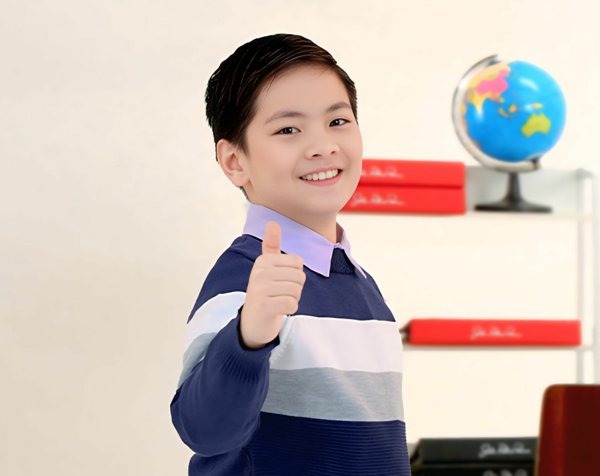 Pre-teen boy giving thumbs up as part of John Robert Powers Personal Growth course building internal confidence